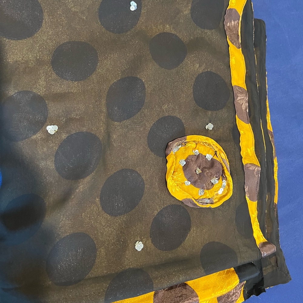 Brown and yellow polka dot sari